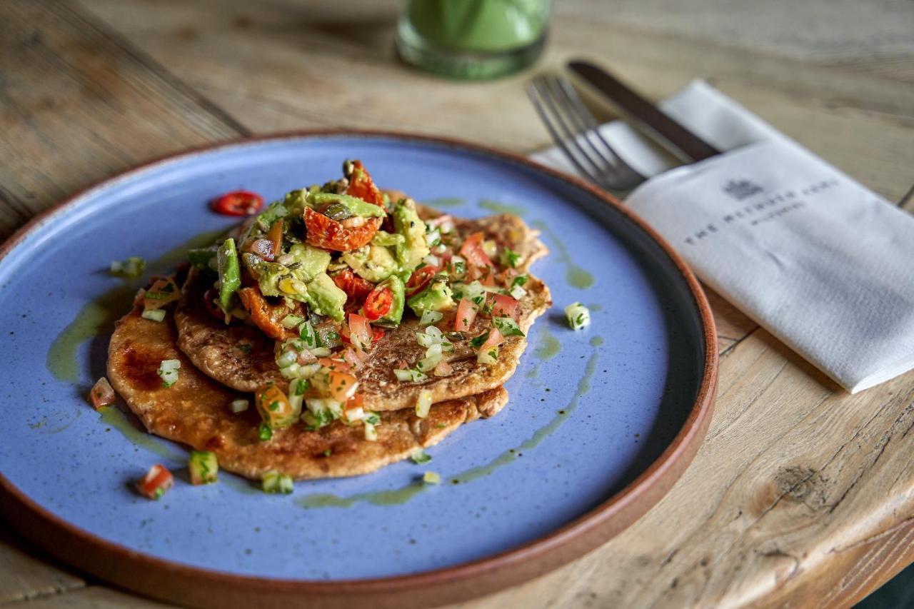 Hotel The Methuen Arms Corsham Exterior foto A plate of chickpea pancakes with a salad